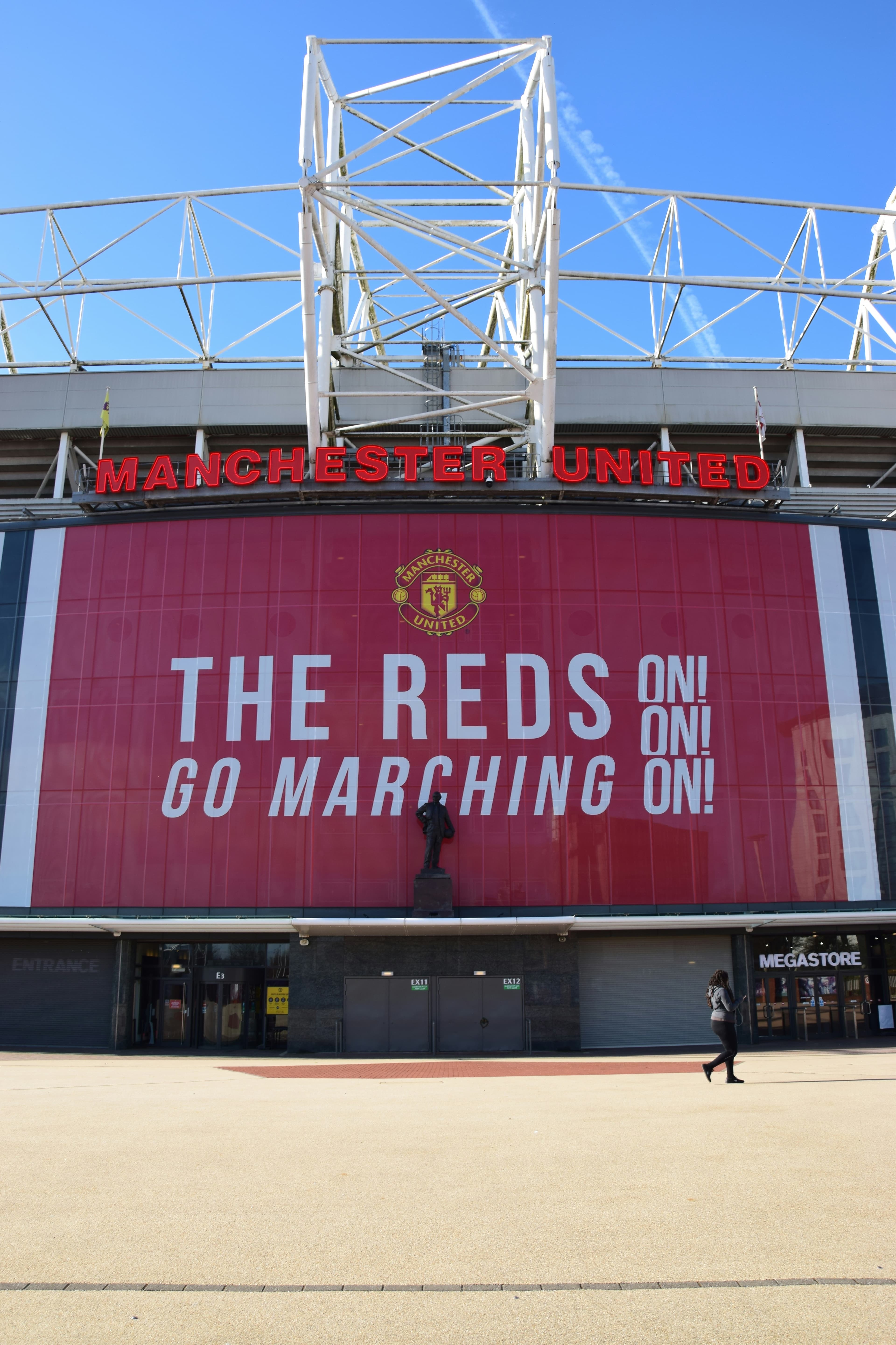 'THE REDS GO MARCHING ON' mural on Old Trafford's forecourt